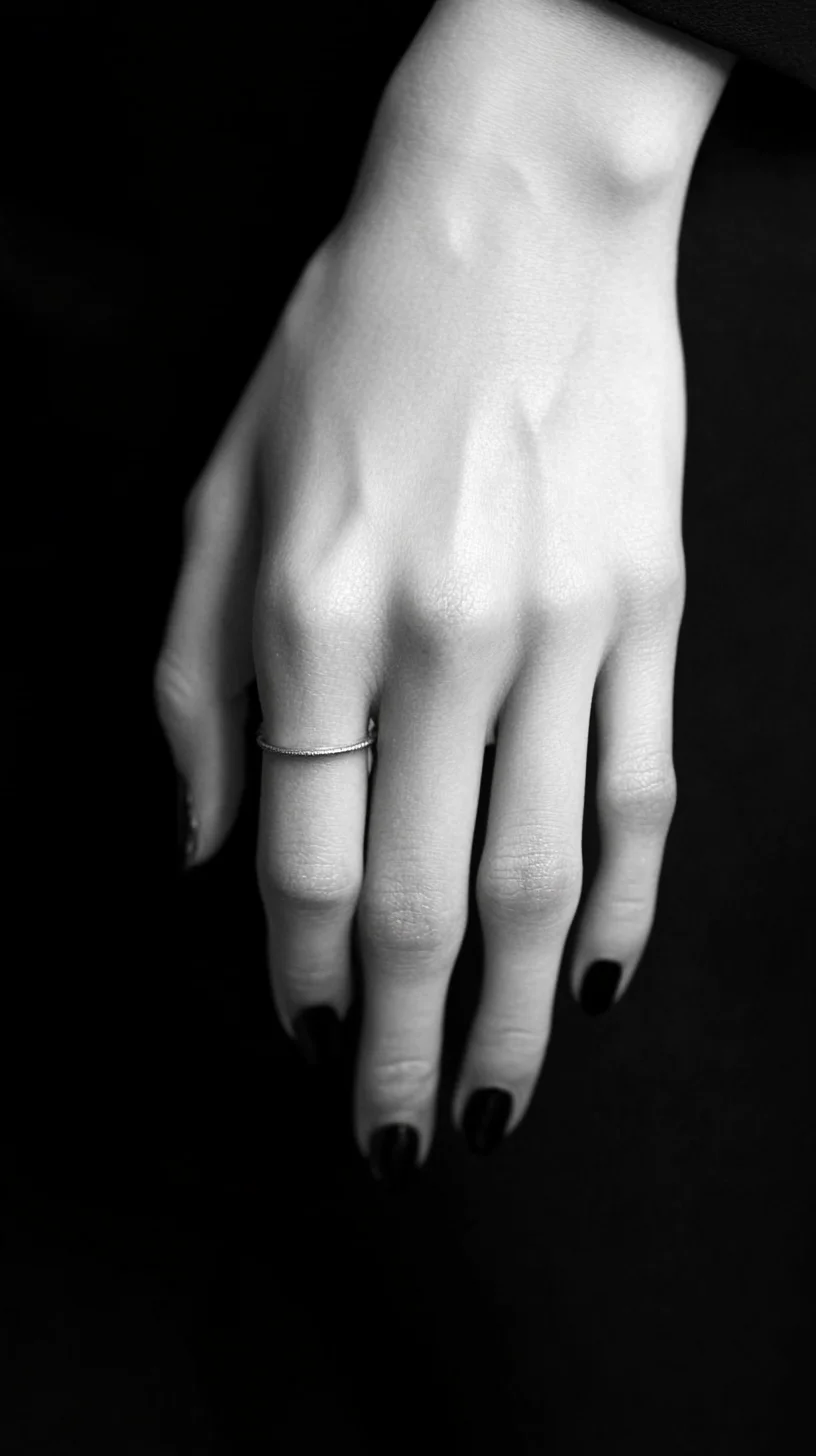 Elevate Your Elegance: Minimalist Black Nail Art and Delicate Ring Style